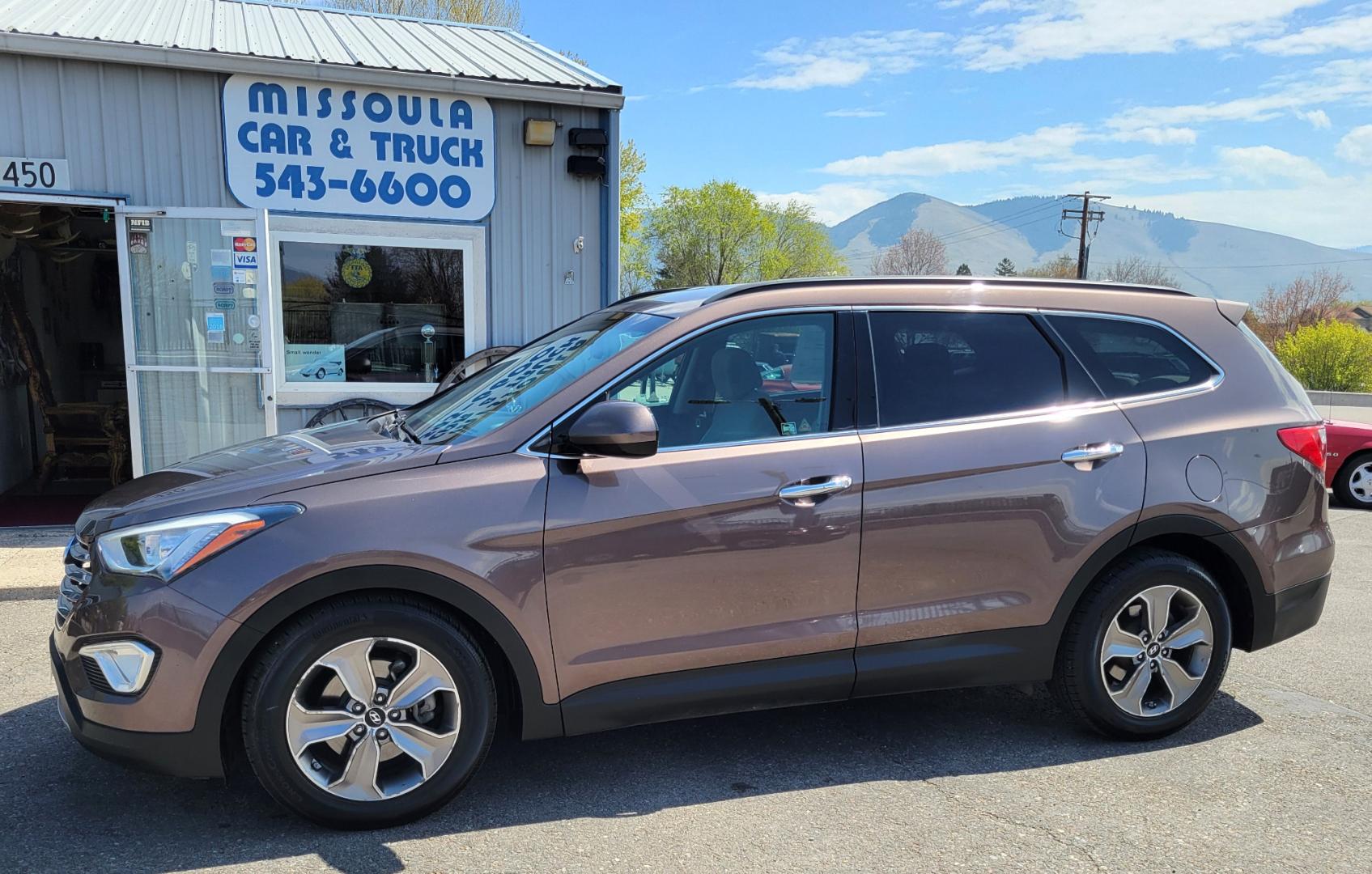 2015 Brown /Tan Hyundai Santa Fe GLS (KM8SMDHF7FU) with an 3.3L V6 engine, 6 Speed Auto transmission, located at 450 N Russell, Missoula, MT, 59801, (406) 543-6600, 46.874496, -114.017433 - Great Running AWD SUV. 3.3L V6 Engine. 6 Speed Automatic Transmission. 3rd Row Seating. Heated Front Seats. Power Drivers Seat. Backup Camera. AM FM XM CD. Bluetooth. Newer Continental Tires from Les Schwab. New Brakes. Air. Cruise. Tilt. Power Windows and Locks. - Photo#0